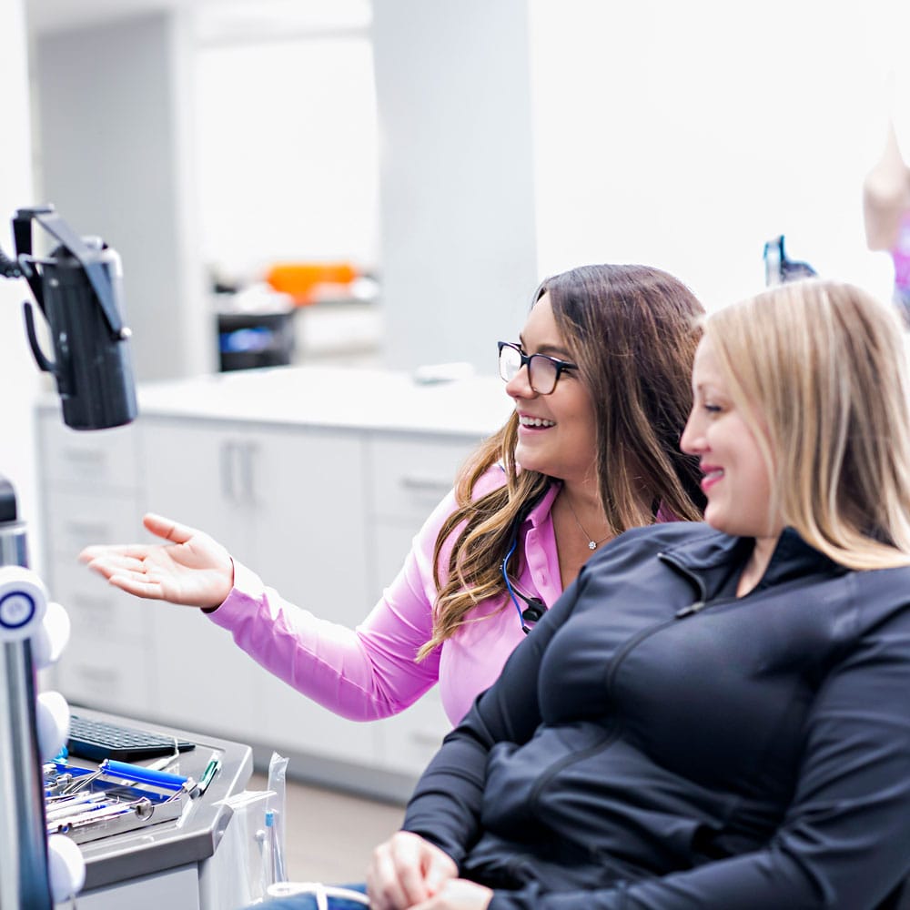 Doctor and patient sitting in a dental chair